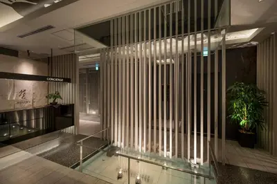 a lobby with a glass floor with a plant at HOTEL\u307f\u306a\u3068-MINATO- in Tokyo