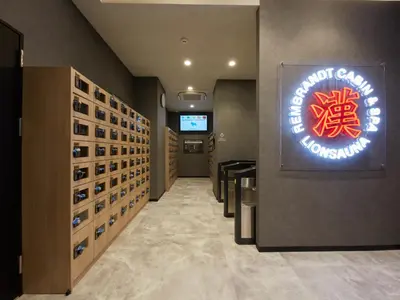 a wine tasting room with a sign on the wall at Rembrandt Cabin & Spa Shimbashi - Caters to Men in Tokyo