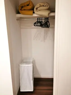 a room with a closet with a shelf and some objects at Bell house in Tokyo