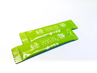 a packet of green packets with asian writing on them at APA Hotel Asakusa Kuramae Kita in Tokyo