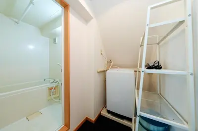 a small bathroom with a toilet and a ladder at Grace Heiwajima by Tranova in Tokyo