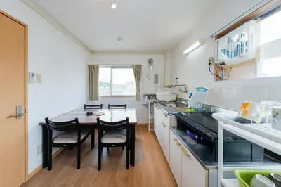 a kitchen with a table and chairs in it at Grace Heiwajima by Tranova in Tokyo