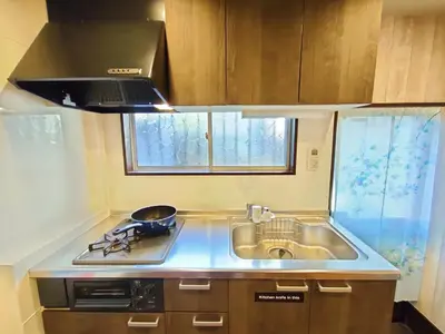 a small kitchen with a sink and a stove at KIKI HOUSE in Tokyo