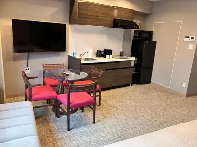 a kitchen with a table and chairs in a room at ENT TERRACE AKIHABARA in Tokyo