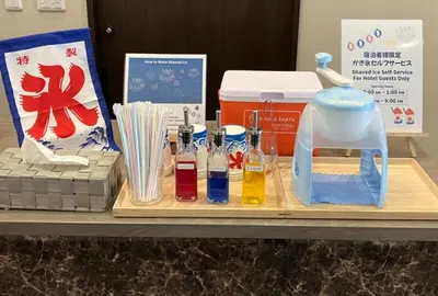 a table with a cutting board with a blender and other items at ENT TERRACE AKIHABARA in Tokyo