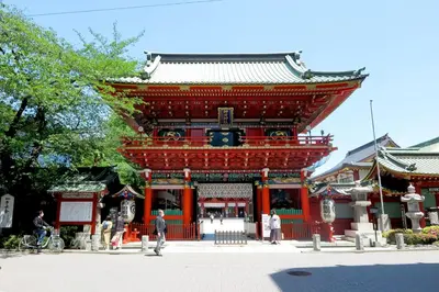 a large red building with people standing in front of it at ENT TERRACE AKIHABARA in Tokyo