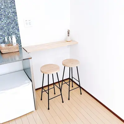 two stools sitting next to a counter in a kitchen at \u5c0f\u6625\u65e5\u548c_SOLAMO_\u5fae\u751c\u9928 in Tokyo