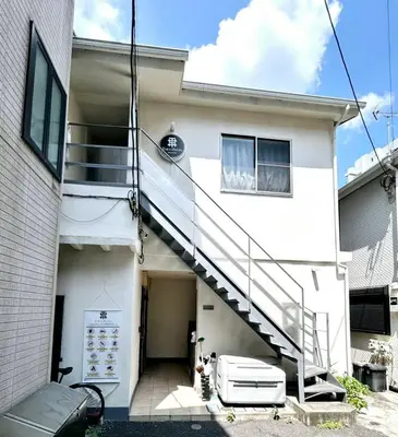 a white house with a staircase in front of it at NEW Heart of Shibuya Prime Studio, Kamiyama Inn! in Tokyo