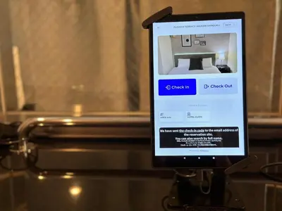 a cell phone that is on a glass table at FLOWER TERRACE Higashi Shinjuku in Tokyo