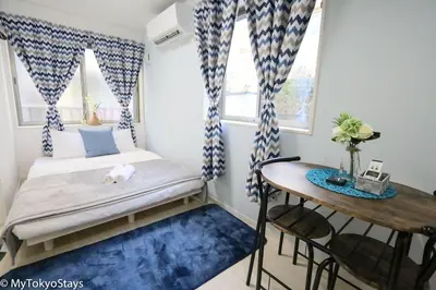 a small bedroom with a bed and a desk at Skytree Easy Access Tokyo Apartment - Bell Flat Inn #1 in Tokyo