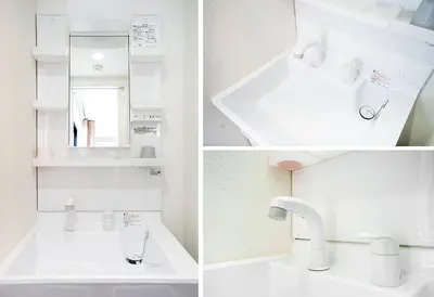a white bathroom with a sink and a mirror at Ustay Nippori in Tokyo