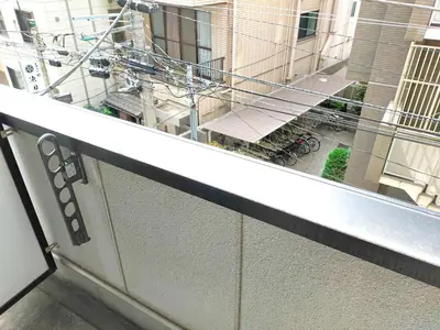 a balcony with a view of a building at Al Di La \u56db\u8c37 in Tokyo