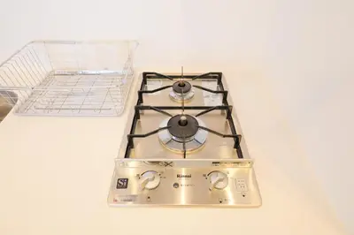a stove top oven sitting on top of a counter at Space Roppongi in Tokyo