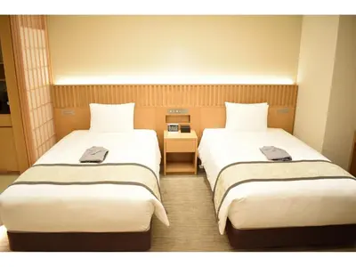 a hotel room with two beds in a room at TOKYO EAST SIDE HOTEL KAIE in Tokyo