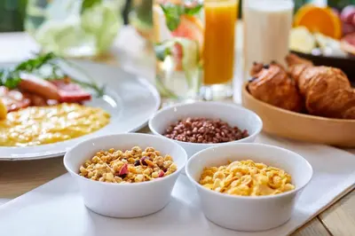 a table topped with bowls of different types of food at TOKYO EAST SIDE HOTEL KAIE in Tokyo