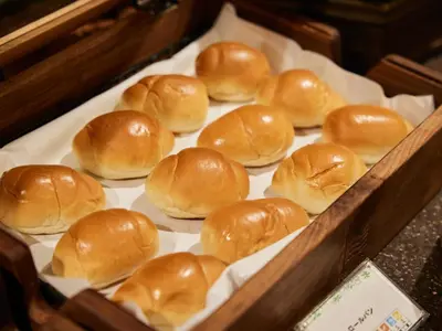 a tray of buns sitting on a table at TOKYO EAST SIDE HOTEL KAIE in Tokyo