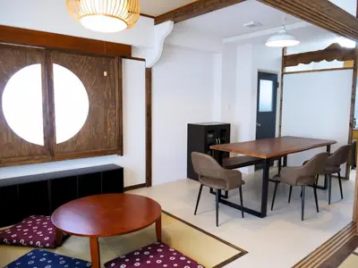 a dining room with two tables and chairs and a window at Amber Iidabashi - Vacation STAY 90505v in Tokyo