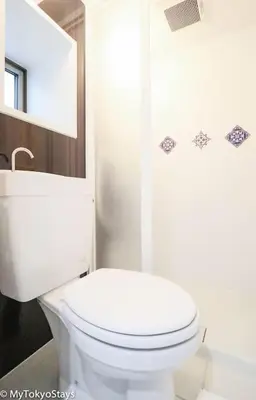 a white bathroom with a toilet and a shower at Skytree Easy Access Studio Apt Bell Flat Inn #3 in Tokyo
