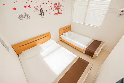 a small bedroom with a bed and a window at SkyTreeStayHotel2\u9418\u30f6\u6df5\u99c5\u304b\u3089\u5f92\u6b694\u5206\u5929\u4e95\u304b\u3089skytree\u304c\u898b\u3048\u307e\u3059 in Tokyo