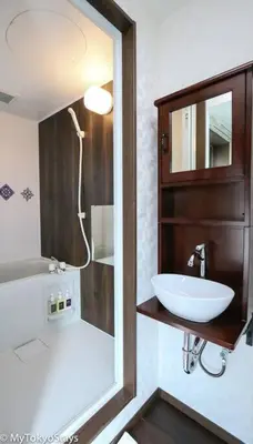 a bathroom with a sink and a mirror at Easy Access to Skytree 1BR Bell Flat Inn #5 in Tokyo