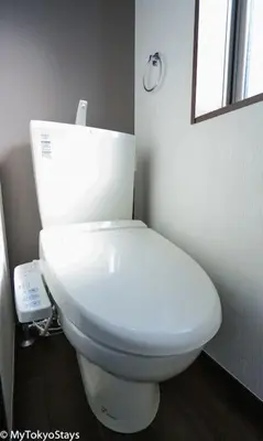 a white toilet in a bathroom with a mirror at Easy Access to Skytree 1BR Bell Flat Inn #5 in Tokyo