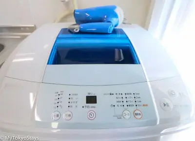 a washing machine with a blue item on top of it at Easy Access to Skytree 1BR Bell Flat Inn #5 in Tokyo