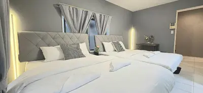 two beds in a hotel room with white sheets and pillows at NEW! Time Square Shibuya Modern Unit. Prime Location in Tokyo