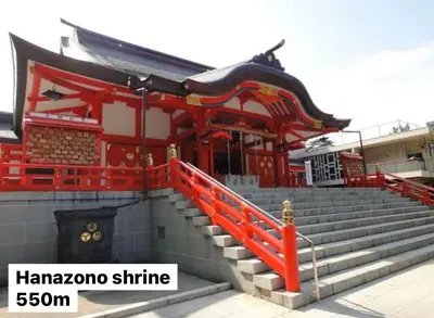 a building with a red gate and stairs at #6 stylish apartment with beautiful night view A stop to Shinjuku station in Tokyo
