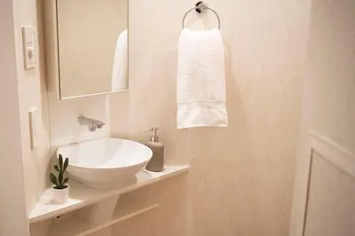 a bathroom with a white sink and a mirror at #6 stylish apartment with beautiful night view A stop to Shinjuku station in Tokyo