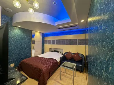 a bedroom with a bed and a blue ceiling at Hotel THE ATTA Adult Only in Tokyo