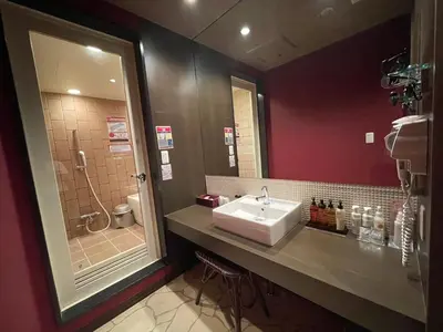 a bathroom with a sink and a shower at Hotel THE ATTA Adult Only in Tokyo