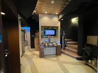 a lobby of a building with a tv on the wall at Hotel THE ATTA Adult Only in Tokyo