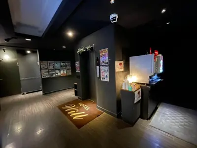 a room with a cash register and a refrigerator at Hotel Will\u6c60\u888b Adult Only in Tokyo
