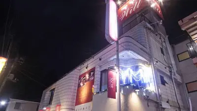 a building with a neon sign in front of it at Hotel Will\u6c60\u888b Adult Only in Tokyo