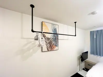 a room with a picture hanging on the wall at MAT OSHIAGE Ⅱ in Tokyo
