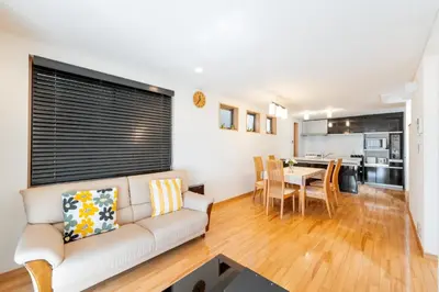 a living room with a couch and a dining room at Fukuhama - Vacation STAY 13867 in Tokyo