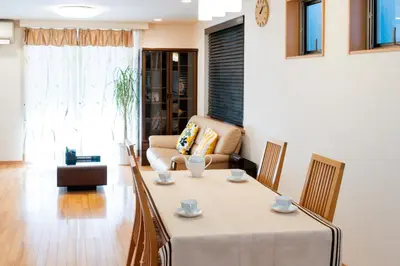 a living room with a table and a couch at Fukuhama - Vacation STAY 13867 in Tokyo