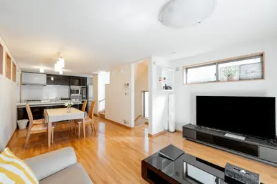 a living room with a large flat screen tv at Fukuhama - Vacation STAY 13867 in Tokyo
