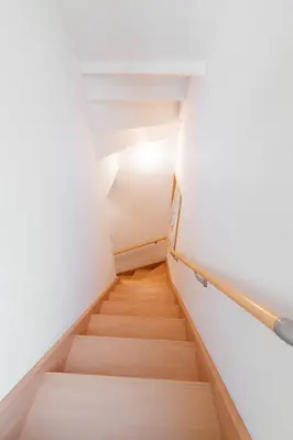 a staircase in a building with white walls and wooden floors at Fukuhama - Vacation STAY 13867 in Tokyo