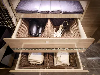 a drawer in a closet with some items in it at Hotel QUEEN ANNEX in Tokyo