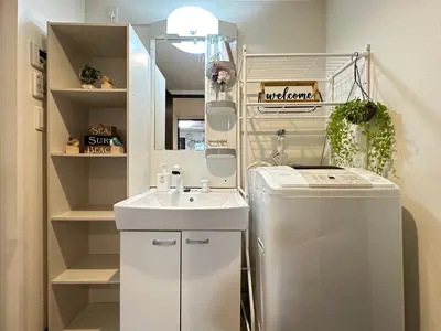 a small kitchen with a sink and a refrigerator at nestay inn tokyo asakusa in Tokyo