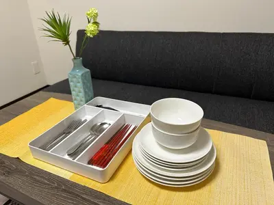 a tray with plates and utensils on a table at nestay inn tokyo asakusa in Tokyo