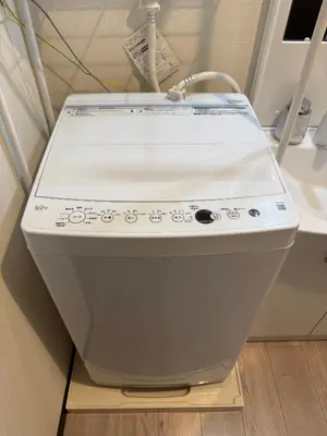 a toilet in a room with a sink at nestay inn tokyo asakusa in Tokyo