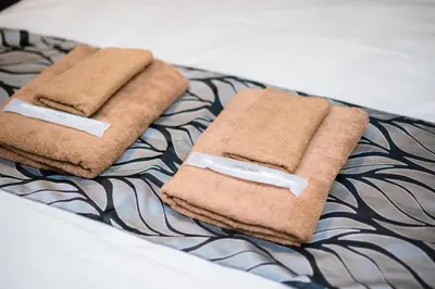 two towels sitting on top of a table at UCHI Asakusabashi in Tokyo