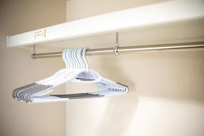 a towel rack with a white and blue striped towel at Minimalism HOTEL TOKYO Katsushika in Tokyo