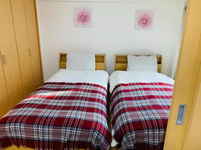 two beds sitting next to each other in a room at K&M Heights - Vacation STAY 20628v in Tokyo