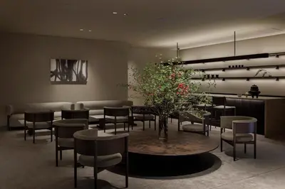 a dining room with chairs and a table with flowers at BELLUSTAR TOKYO, A Pan Pacific Hotel in Tokyo