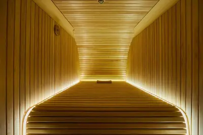 a sauna with a bench in the middle of a tunnel at Boutique Sauna ARCH in Tokyo