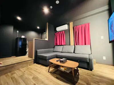 a living room with a couch and a table at Asakusa-Smile-SM0141 in Tokyo