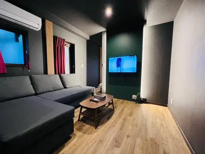 a living room with a couch and a table at Asakusa-Smile-SM0141 in Tokyo
